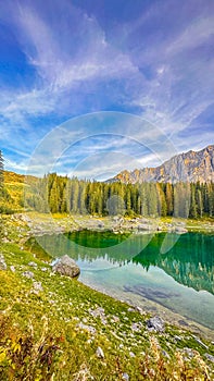 Lago di Carezza,A celestial altitude at 1,519m, an alpine haven with emerald waters photo