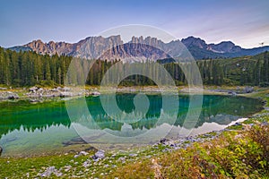 Lago di Carezza, Emerald waters, misty forests, Latemar views, an Alpine masterpiece. photo