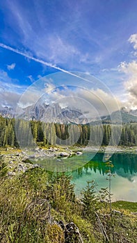 Lago di Carezza,A gem at 1,519m, an alpine marvel with emerald waters photo