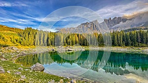 Lago di Carezza,Graceful at 1,519m, an alpine gem with emerald waters photo