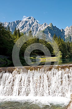 Lago di Fusine e monte Mangart with waterfall