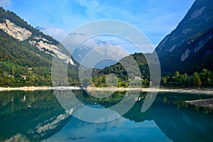 Lago di Tenno with its clear turquoise water in the morning light. Trentino, Italy