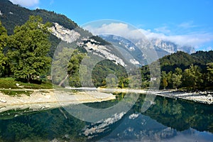 Lago di Tenno with its clear water on a beautiful morning. Trentino, Italy