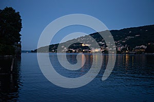 Lago Maggiore, Italy. Town of Stresa seen from the lake by night photo