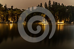 Lago Negro lake with fog, lights and reflection photo