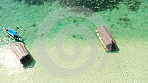 A lagoon with floating crotches, top view. Manlawi Sandbar floating cottages in Caramoan Islands.