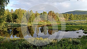 Lagoon at Storforsen Norrbotten Sweden at wintertime a blue cold autumn day.