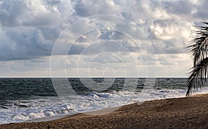 Lagos Beaches; Sandy beach with tourists in La campagne tropical beach resort Ibeju Lekki