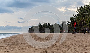 Lagos Beaches; Sandy beach with tourists in La campagne tropical beach resort Ibeju Lekki photo