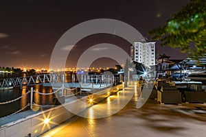 Lagos five cowries creeks at night with Victoria Island bridge in the distance