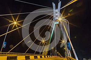Lagos Nigeria night scene of the Ikoyi Lekki cable stayed link bridge with closeup view of the suspension tower and cables.