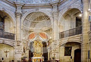 Laguardia, Alava, Spain. March 30, 2018: Main altar, golden altarpiece and apse of the Romanesque-Gothic church-fortress called Sa