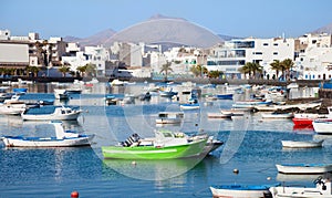 Laguna at the city of Arrecife with fishermen boats photo