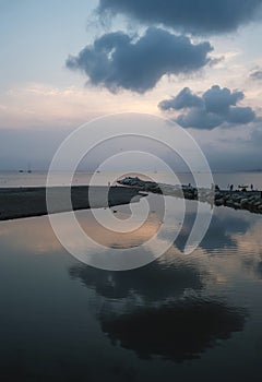 laguna of the Ligurian sea in Sestri Levante, Liguria, Italy. Natural background. Clouds reflecting in the water surface