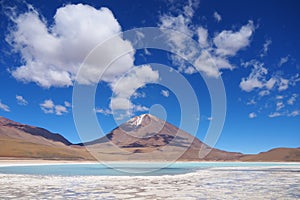 Laguna Verde in Bolivia with scenic clouds photo