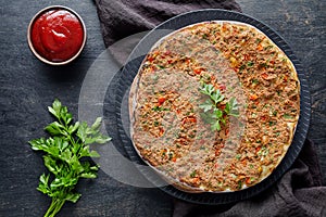 Lahmacun traditional turkish homemade pizza with minced beef or lamb meat, paprika