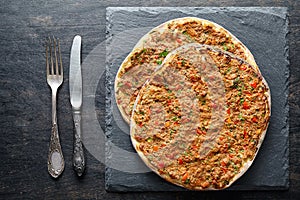 Lahmacun traditional turkish pizza with minced beef meat, paprika tomatoes, parsley