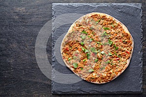 Lahmacun turkish gourmet pizza with minced beef or lamb meat, paprika, tomatoes