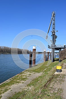 Lahnstein, Germany - 03 24 2021: Rhine harbor crane and pylons