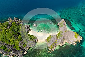 Lahos Island, Caramoan Islands, Philippines. White sand beach with a coral reef, top view.