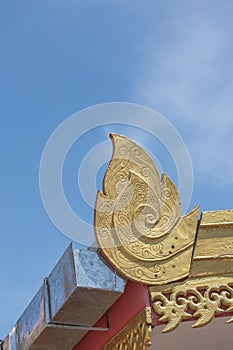 Lai thai pattern on the roof of building in the temple public location in thailand with blue sky background