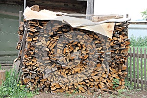It laid a pile of wood intended for kindling furnace