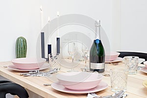 Laid table with bottle of sekt