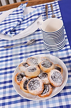 Laid table - fork and spoon laid on blue cloth and white plate