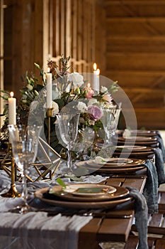 Laid Table By wedding banquet in a barn. Vertical frame