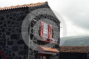 Lajido village Pico Island Azores black lava houses red windows