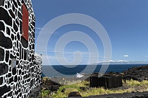 Lajido village Pico Island Azores black lava houses red windows