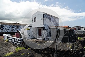 Lajido village Pico Island Azores black lava houses red windows