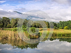 Lake against misty mountains