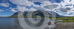 Lake Akkajaure below Akka Mountain Massif summer view in Sweden