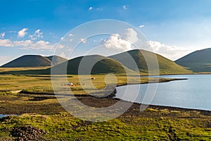 Lake Akna with volcanos in background, Geghama mountains, Armenia