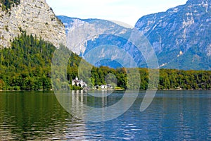 Lake among alpine mountains in the city of Hallstadt in Austria