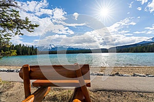 Lake Annette lake shore beach and bench. Jasper National Park, Canadian Rockies, Alberta, Canada.