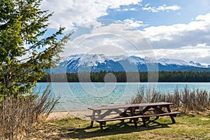 Lake Annette lake shore beach and bench. Jasper National Park, Canadian Rockies, Alberta, Canada.