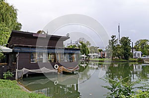 Lake Ariana with cosy nook for autumn relaxation with friends  after heavy rain, park Borisova gradina