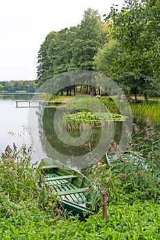 Lake background with wooden boats