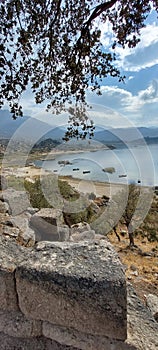 Lake Bafa.  The ancient city of Heraclea.  TÃ¼rkiye.  Bay with boats.  Mountains of Latmos.  Ancient Kariya