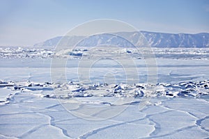 Lake Baikal, cracks in ice. Winter landscape