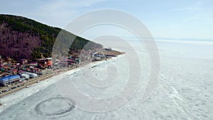 Lake Baikal in early spring. Listvyanka village, a popular place for traveling