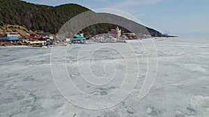 Lake Baikal in early spring. Listvyanka village, a popular place for traveling.