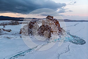 Lake Baikal. Island Olkhon. Shamanka Rock on a cloudy winter morning.