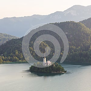 Lake Bled, island with a church and the alps in the background, Slovenia photo