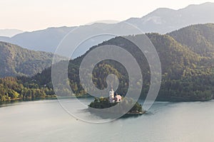 Lake Bled, island with a church and the alps in the background, Slovenia photo