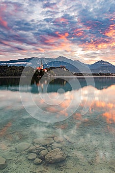 Lake Bled SLovenia and Island Church. Beautiful Sunrise and Water Reflection. Romantic Travel Destination