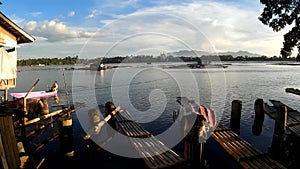 Lake boatman paddle his row boat across the lake