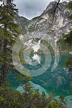 Lake Braies also known as Lago di Braies. The lake is surrounded by the mountains which are reflected in the water